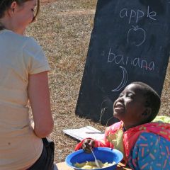 Volunteer & orphaned child at care center