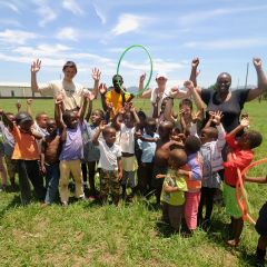Volunteer with kids at care center